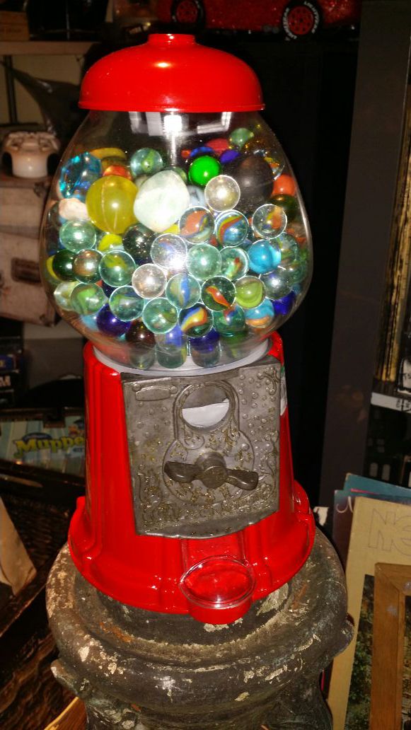 Gumball machine filled with marbles,rocks and crystals