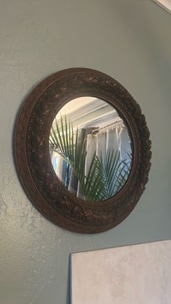 A little over one foot antique wood carved portal mirror