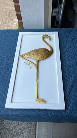 This decorative wall art features a textured