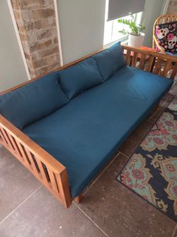 Outdoor patio daybed with cushions
