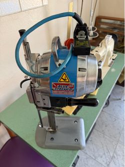 Sewing machine and cloth cutting machine
