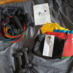 Set Of Exercise Items Including Weights Ropes And Bands