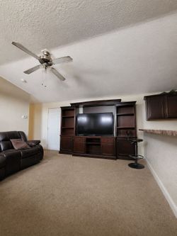 Entertainment center with  TV.
