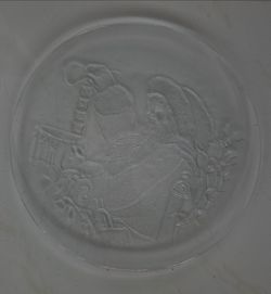 Two vintage embossed clear glass platters, 13 inch diameter, one Santa Noel design, one calla lily pattern, no chips or cracks.