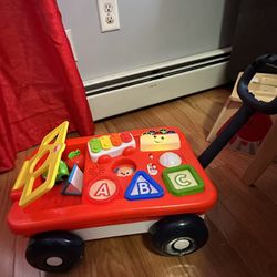 Fisher-Price Laugh & Learn Pull & Play Learning Wagon Baby & Toddler Toy with 4 Accessories