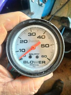 White-faced Auto Meter Phantom Blower Gauge.
