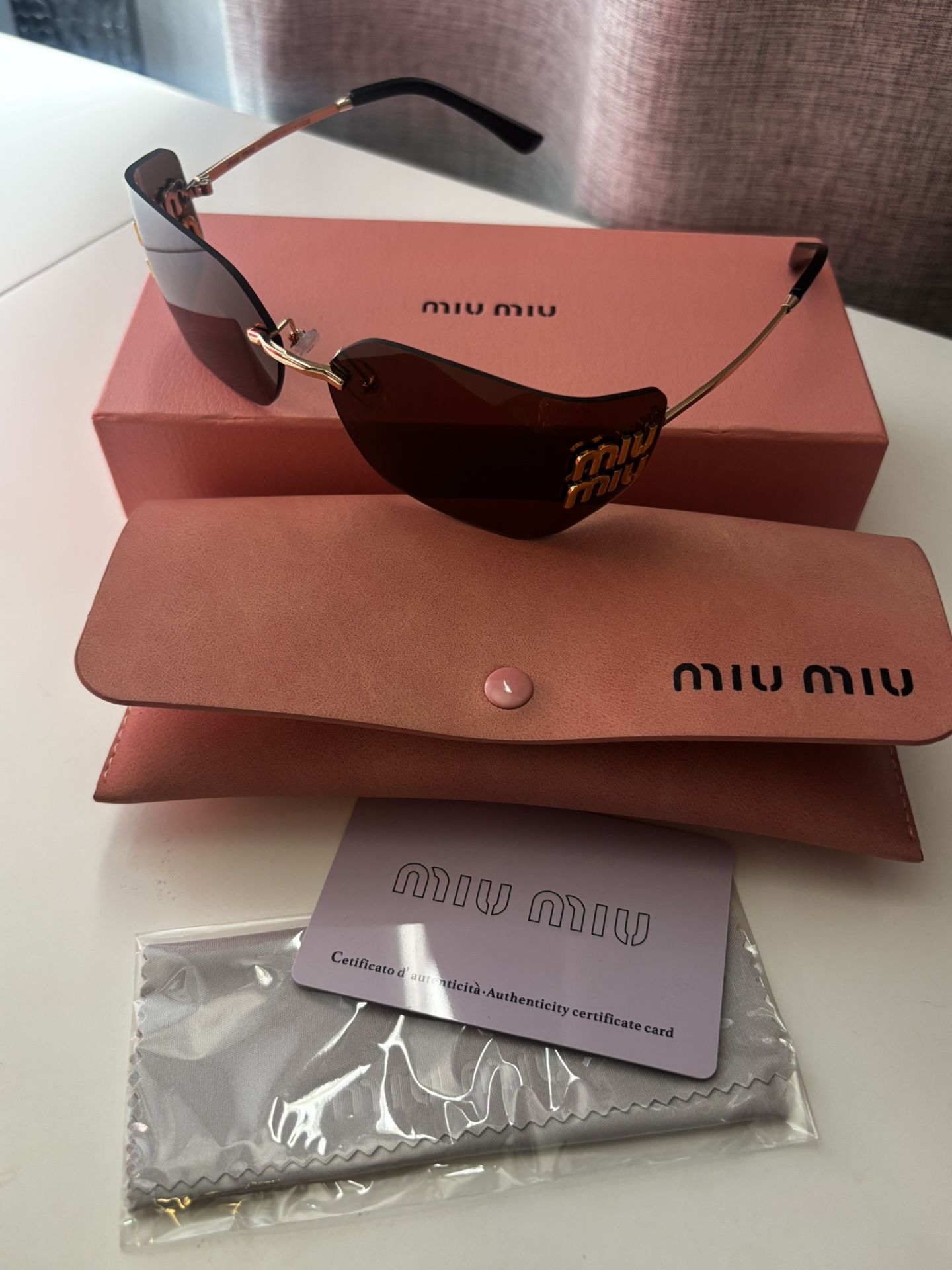 MIU MIU SUNGLASSES