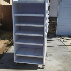 USED AS A HAT RACK  MOVABLE SHELVES 