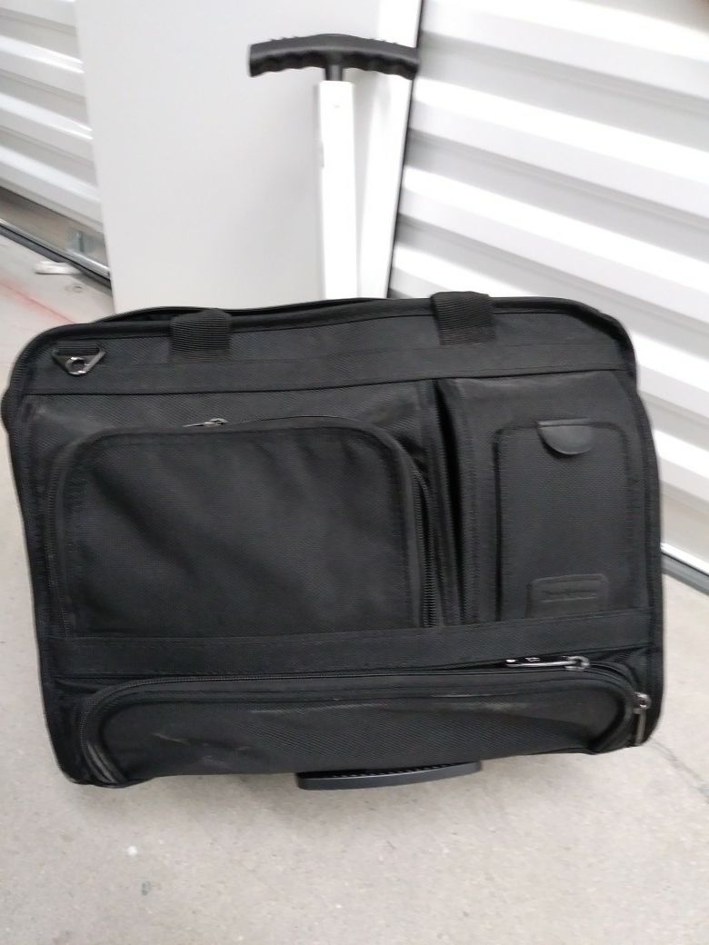 Multi-pocketed wheeled briefcase