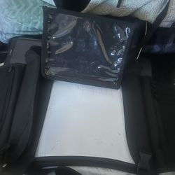 tablet holder and has side pockets and a place to put paper to draw