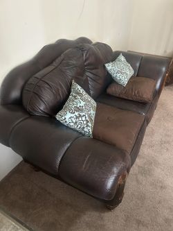 BROWN LEATHER LOVESEAT