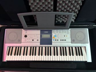 - Yamaha PSR E323 61 Key Portable Keyboard with Music Stand