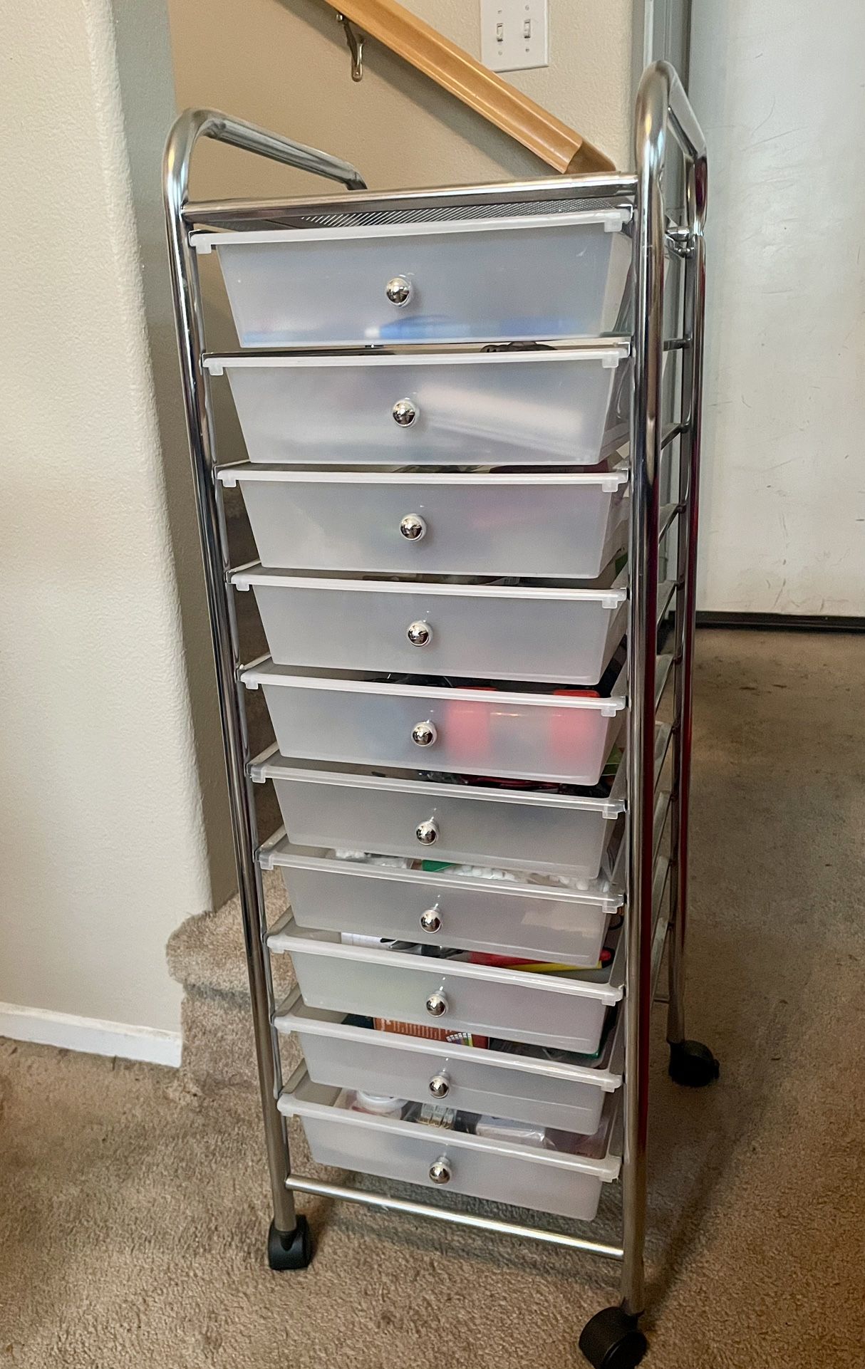 Rolling storage organizer with multiple drawers.