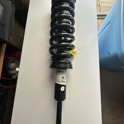 The Unity Automotive 11921 is a front-left complete strut assembly designed for 2007-2013 Toyota Tundra (4WD models)