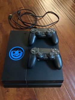 PS4 console with 2 controllers
