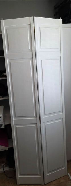 Two White Wooden Bifold Doors