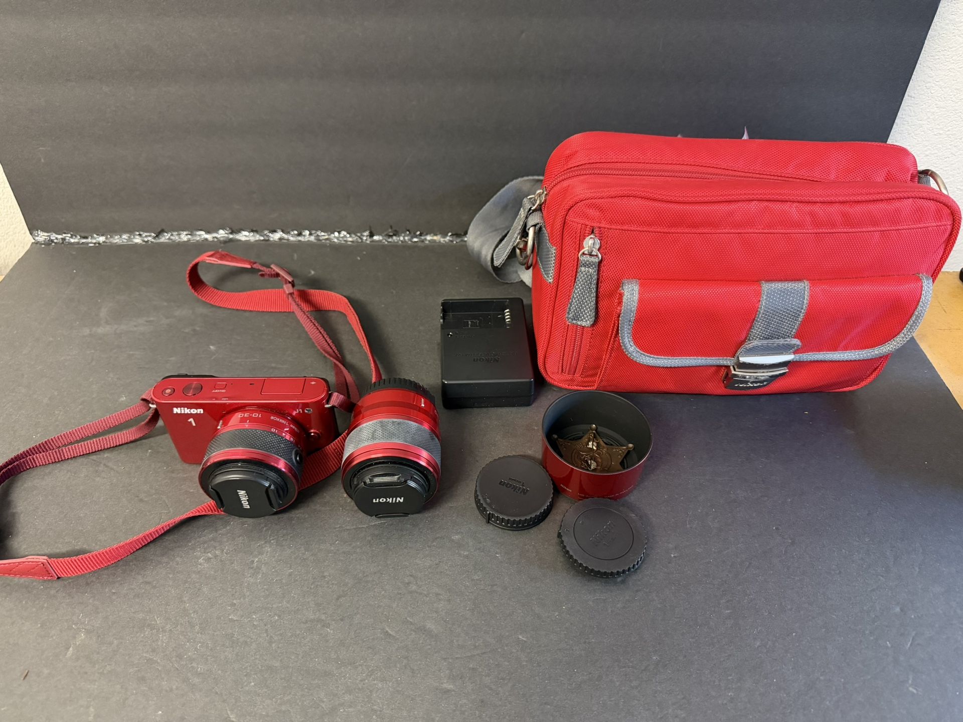 Nikon J1 Digital Camera With Two Lenses And Camera Bag