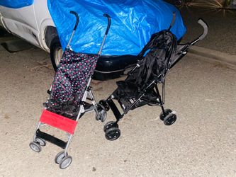 Two lightweight umbrella fold up strollers 1 with a Sun visor 1 without