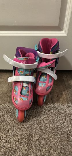 Roller Derby adjustable kids’ inline skates with a rainbow/unicorn-themed design.