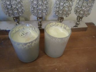 2 candles in glas containers
