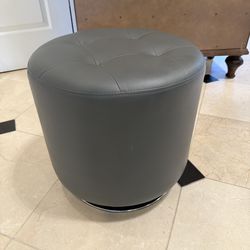 Grey round ottoman