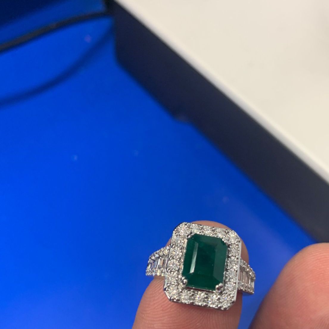 Large center Emerald with diamond baguettes