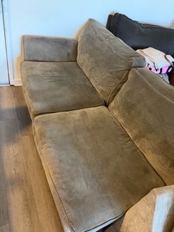 Gray L-shape couch with queen bed