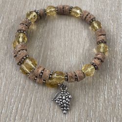 Elegant Yellow And Brown Beaded Bracelet With Silver Charm