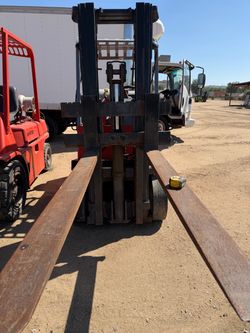Heavy-duty Yale forklift with extra-long approximately 70-inch forks.
