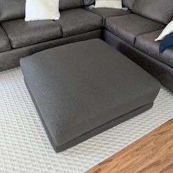 Brand New Living Spaces Xena Ottoman (43") – Sanello Ebony – Just Delivered
