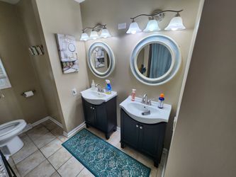 Two Distressed, 26" Round, Mirrors
