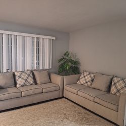 A large three-seater sofa that is in like-new and clean condition