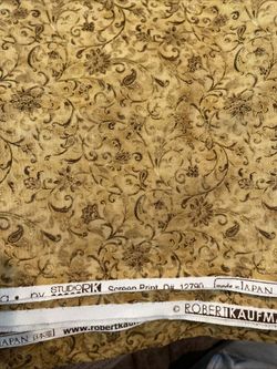 Robert Kaufman.  La Scala 4, Floral in Gold.  Sold by the yard.