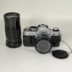 Canon AE-1 35mm SLR Film Camera with Canon FD 50mm f/1.8 & 200mm f/4 Lenses