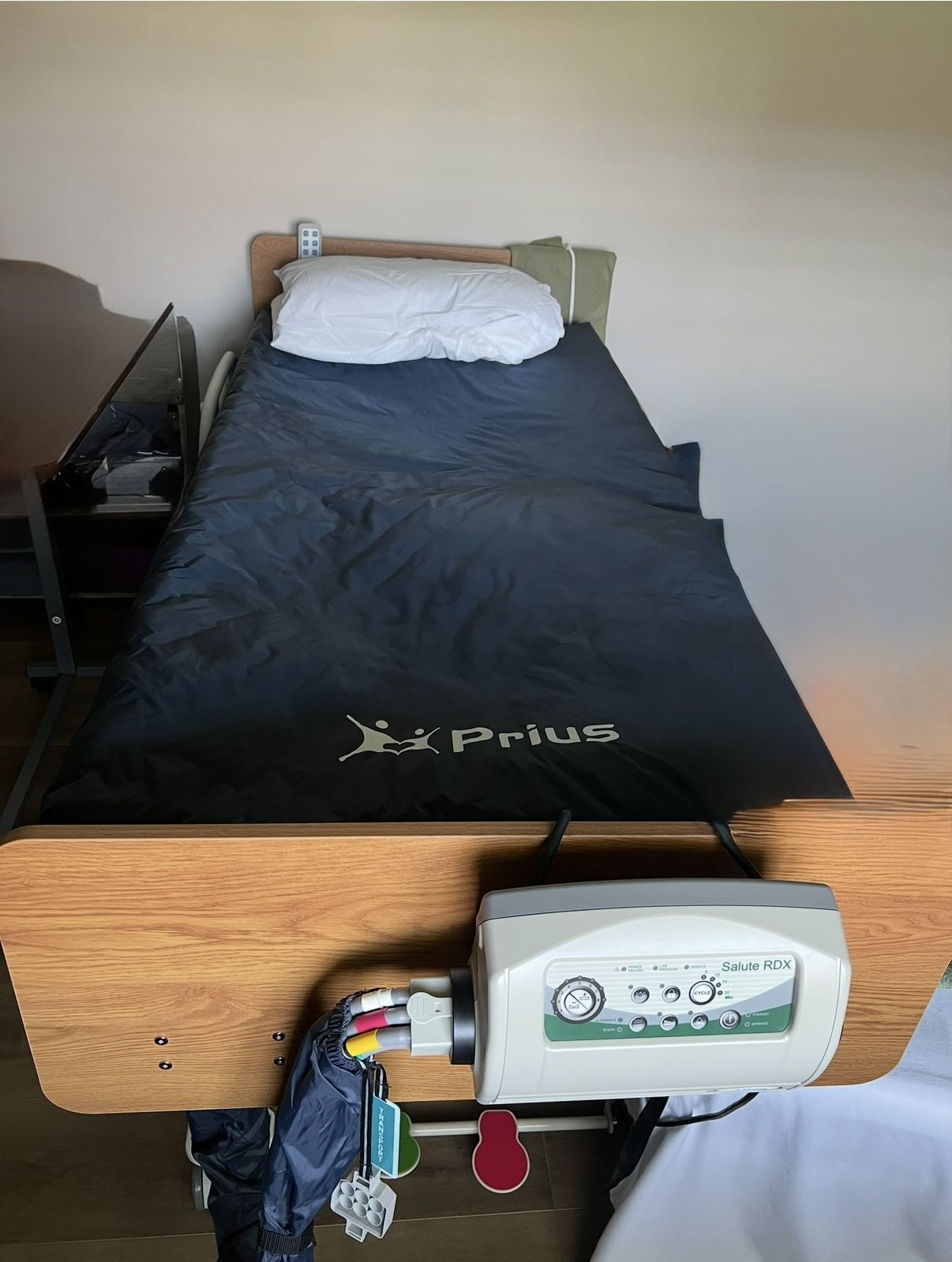 Electric Adjustable Bed With Alternating Pressure Prius Mattress And Adjustable Over Bed Table