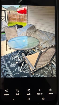 Glass patio table with 2  mesh material folding chairs