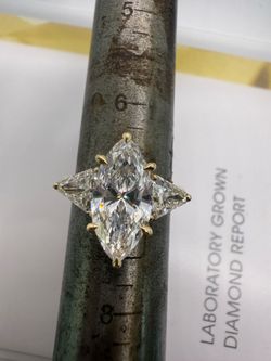 3.02 carat e vs1 marquise lab diamond three stone engagement ring with trillions
