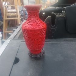 2 red vases or candle holders. 