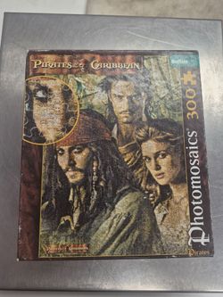 Buffalo Games 300-piece Pirates of the Caribbean Photomosaics jigsaw puzzle featuring Captain Jack Sparrow, Will Turner, and Elizabeth Swann.