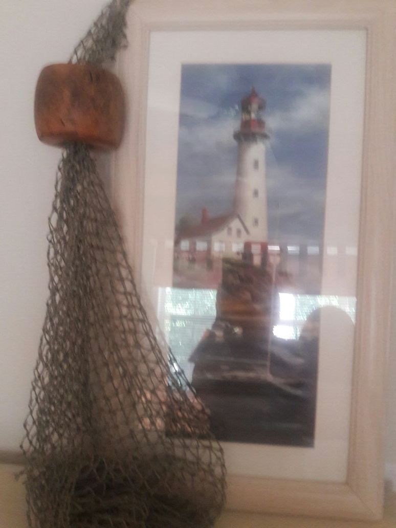 Lighthouse picture with fisherman net