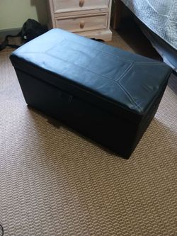 Black vinyl storage bench.