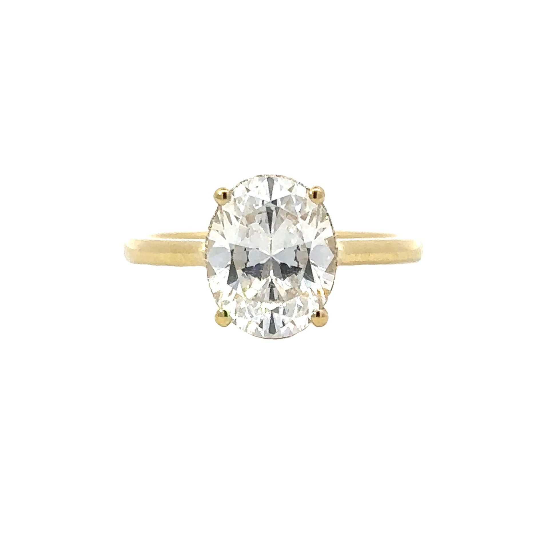 Hidden Halo Engagement Ring in 18K Yellow Gold Shimmering solitaire with thirty-eight dazzling diamonds set in a hidden halo semi mount. Total diamond