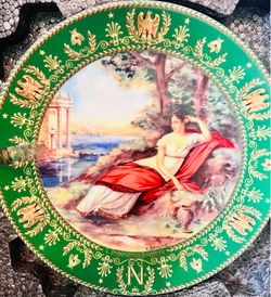 This is a vintage D'Arceau-Limoges collector's plate featuring a green border decorated with gold eagles, bees, and laurel wreaths