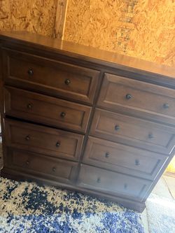 The rustic brown Ashley Furniture Porter Dresser  8 Drawers