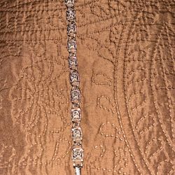 vintage Sarah Coventry silver-tone bracelet features a rose flower link design.