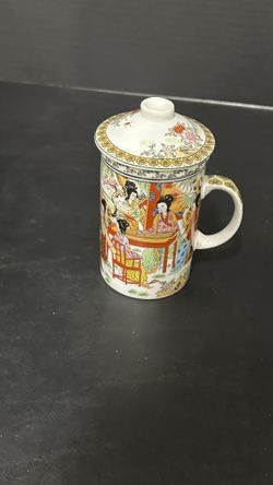 Chinese tea cup with strainer