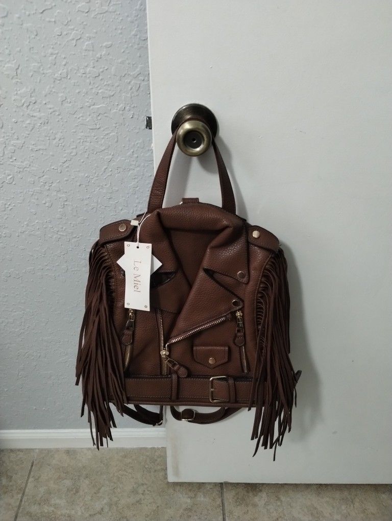Brand New with tags Super cute, very unique brown fringe jacket Backoack purse