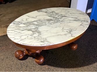 Italian marble top and wood base oval coffee table