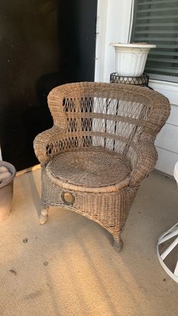 Small wicker chair and small white metal table