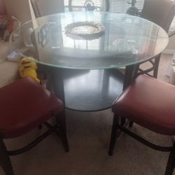 High top glass dinning table with four full size chairs